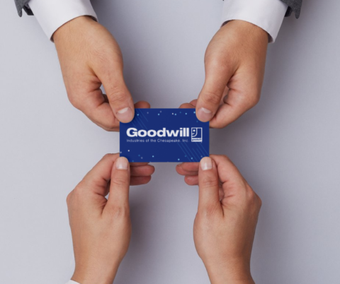 Goodwill gift card being given to someone