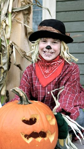 Kid in scarecrow costume