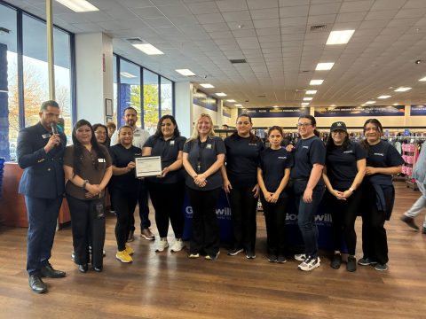 The Laurel Goodwill staff posing to receive an award.