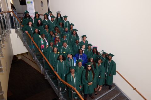 2026 Excel Graduates lined up on stairs