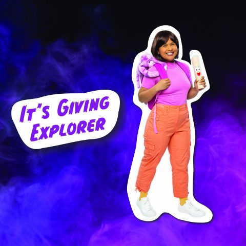 A young woman dressed up as Dora the Explorer from the 2000s cartoon for a nostalgic Halloween costume.